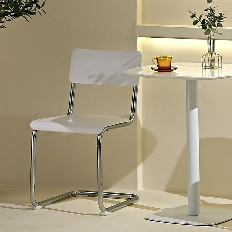 Cantilever Stable Armless Chair with Foot Pads, Open Back and Metal Base in a Modern Style - image 9